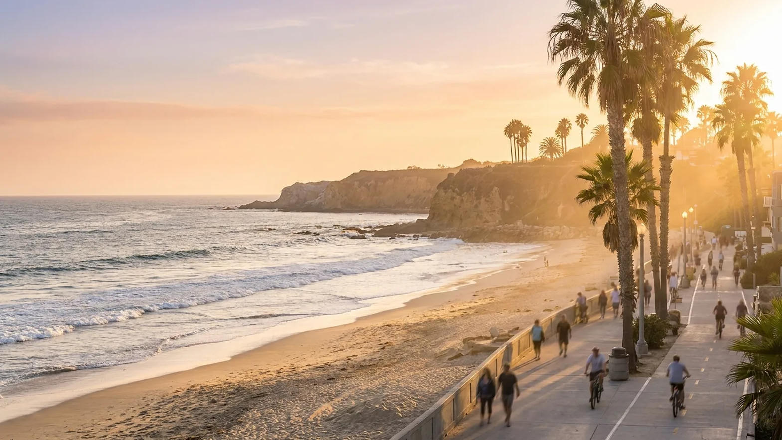 The beach bike path along the sand, palms and late light, riding toward the bluffs
